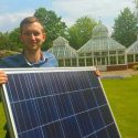 Man holding solar panel