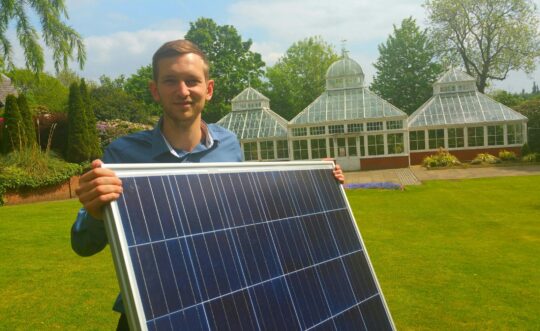 Man holding solar panel