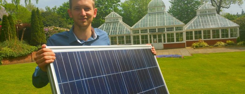 Man holding solar panel